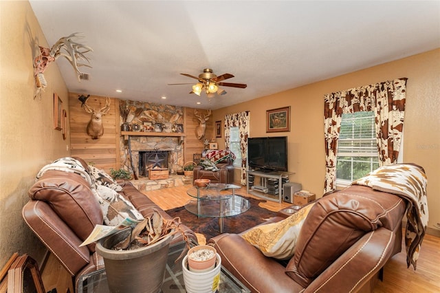 2410 Thornton Rd, Zolfo Springs, FL 33890 - living area with wood finished floors, a ceiling fan, a fireplace, wood walls, and recessed lighting