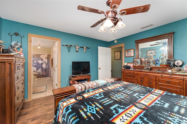 2410 Thornton Rd, Zolfo Springs, FL 33890 - bedroom with wood finished floors, connected bathroom, and ceiling fan