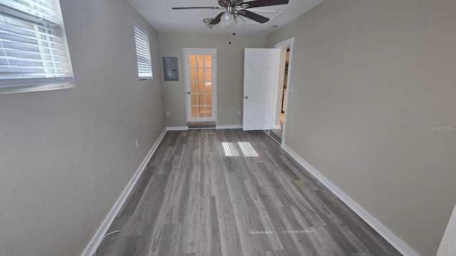 1514 Crest Ave, Leesburg, FL 34748 - empty room with a ceiling fan, dark wood finished floors, and electric panel
