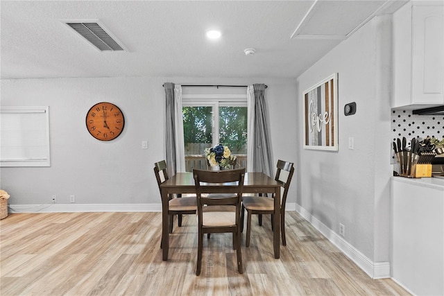 4460 67th St N, Saint Petersburg, FL 33709 - dining space featuring light wood-style flooring