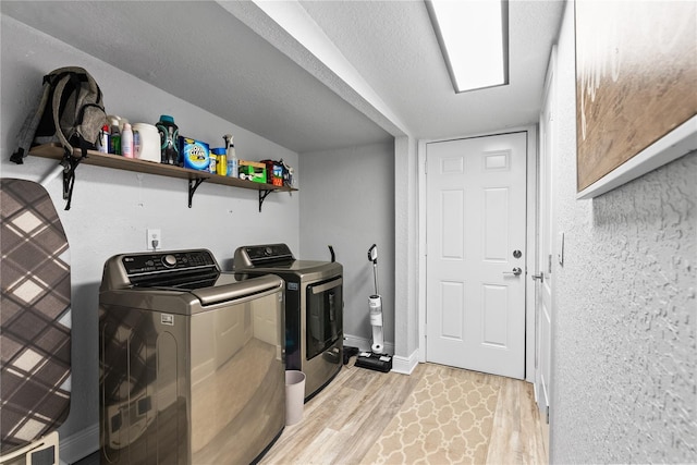 4460 67th St N, Saint Petersburg, FL 33709 - laundry area with washing machine and dryer and light wood finished floors