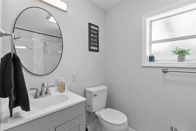 4460 67th St N, Saint Petersburg, FL 33709 - full bath with vanity, a textured wall, and a shower