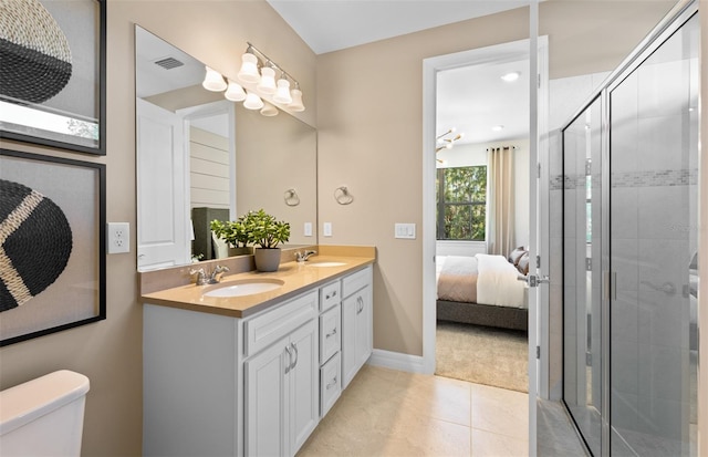 5719 Silverside Pine Ct, Lakewood Ranch, FL 34211 - full bathroom with double vanity, a shower stall, tile patterned flooring, and ensuite bathroom