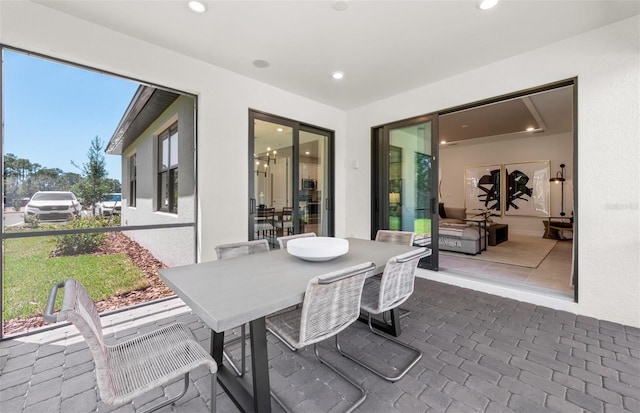 5719 Silverside Pine Ct, Lakewood Ranch, FL 34211 - view of patio / terrace featuring outdoor dining space and french doors