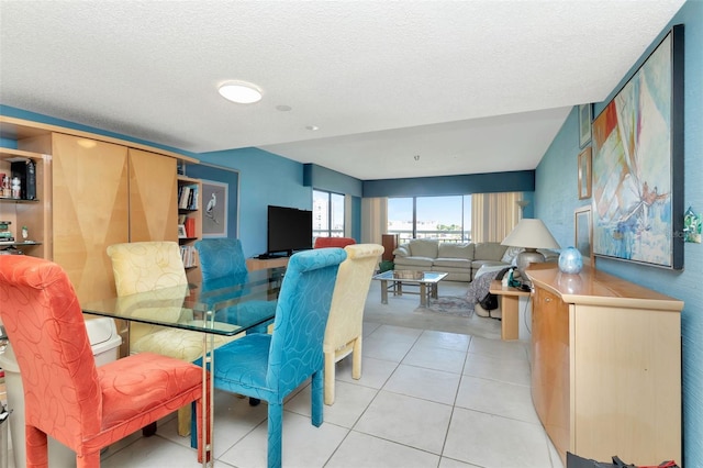 7893 Sailboat Key Blvd S Unit 304, South Pasadena, FL 33707 - dining room with a textured ceiling and light tile patterned floors