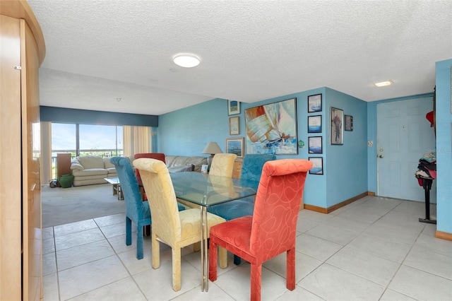 7893 Sailboat Key Blvd S Unit 304, South Pasadena, FL 33707 - dining space featuring a textured ceiling and light tile patterned floors