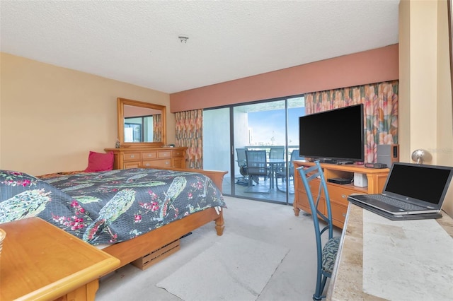 7893 Sailboat Key Blvd S Unit 304, South Pasadena, FL 33707 - bedroom with access to exterior, carpet floors, and a textured ceiling