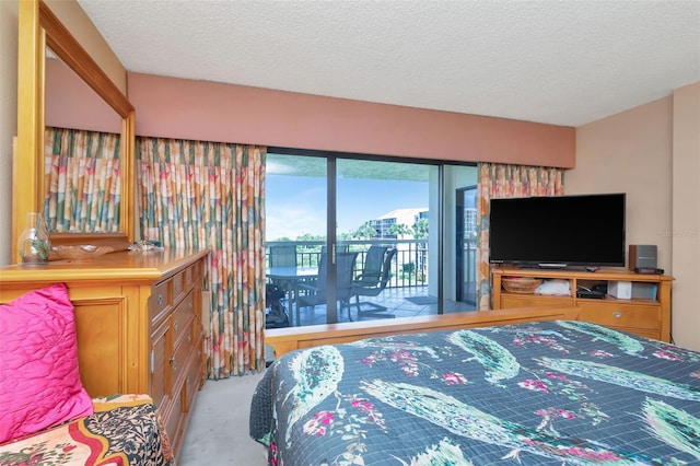 7893 Sailboat Key Blvd S Unit 304, South Pasadena, FL 33707 - bedroom with access to outside, carpet flooring, and a textured ceiling