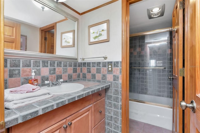 7893 Sailboat Key Blvd S Unit 304, South Pasadena, FL 33707 - bathroom with vanity, enclosed tub / shower combo, tile patterned flooring, tile walls, and crown molding