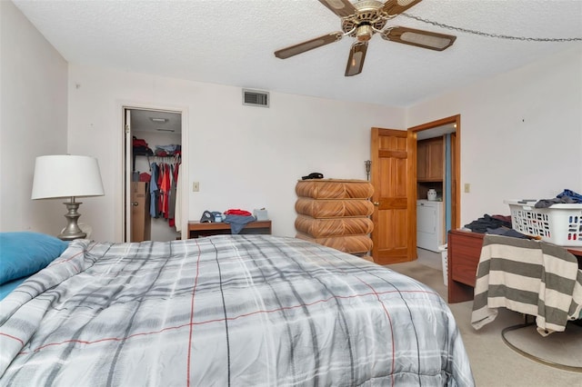 7893 Sailboat Key Blvd S Unit 304, South Pasadena, FL 33707 - bedroom with light carpet, a textured ceiling, a closet, a spacious closet, and a ceiling fan