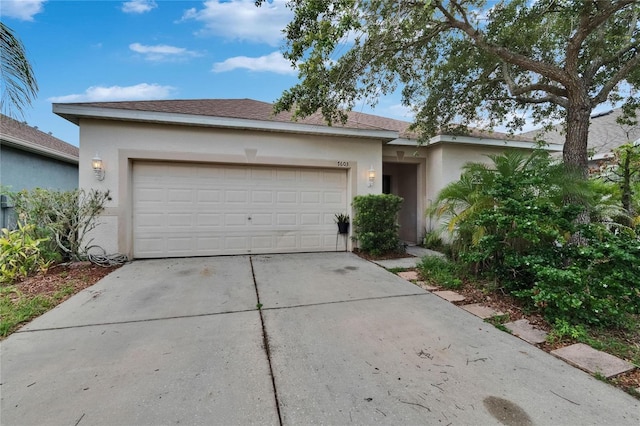 7603 Wood Violet Dr, Gibsonton, FL 33534 - ranch-style house with stucco siding, driveway, and a garage