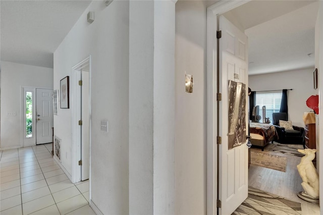 7603 Wood Violet Dr, Gibsonton, FL 33534 - hallway with plenty of natural light and light tile patterned floors