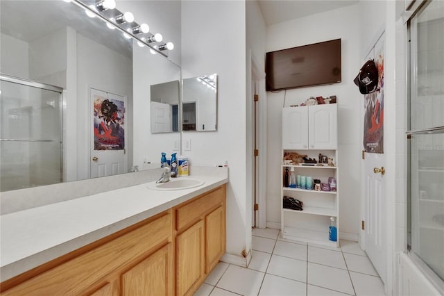 7603 Wood Violet Dr, Gibsonton, FL 33534 - bathroom with tile patterned floors, an enclosed shower, and vanity