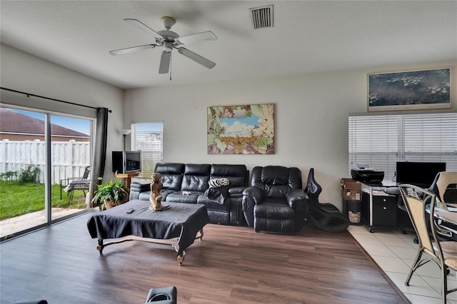 7603 Wood Violet Dr, Gibsonton, FL 33534 - living area with ceiling fan, wood finished floors, and a desk