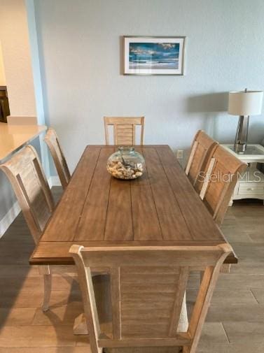 706 Bayway Blvd Unit 502, Clearwater Beach, FL 33767 - dining space with wood finished floors