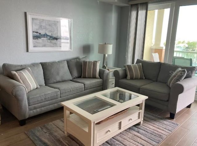 706 Bayway Blvd Unit 502, Clearwater Beach, FL 33767 - living room featuring wood finished floors
