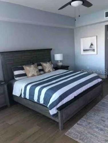 706 Bayway Blvd Unit 502, Clearwater Beach, FL 33767 - bedroom with wood finished floors and ceiling fan