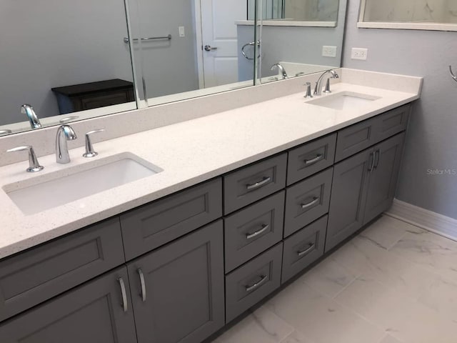 706 Bayway Blvd Unit 502, Clearwater Beach, FL 33767 - bathroom with marble look tiles and double vanity