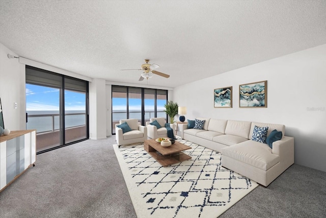 1340 Gulf Blvd Unit 12A, Clearwater Beach, FL 33767 - carpeted living area featuring ceiling fan and a textured ceiling