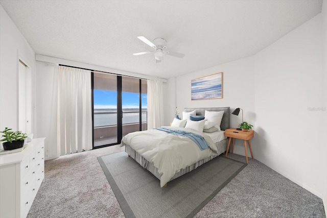 1340 Gulf Blvd Unit 12A, Clearwater Beach, FL 33767 - bedroom featuring light carpet, access to exterior, and a ceiling fan
