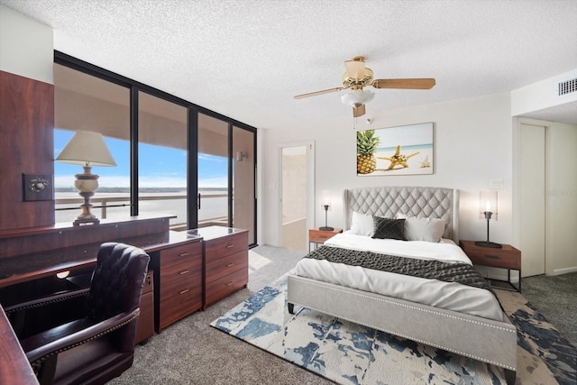 1340 Gulf Blvd Unit 12A, Clearwater Beach, FL 33767 - carpeted bedroom with an office area, a textured ceiling, access to outside, and ceiling fan