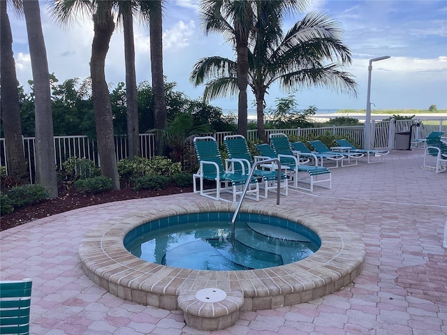 1340 Gulf Blvd Unit 12A, Clearwater Beach, FL 33767 - view of swimming pool featuring a patio area and a hot tub