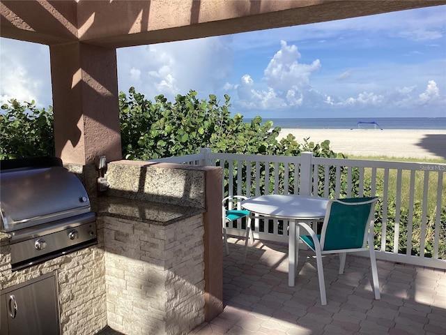 1340 Gulf Blvd Unit 12A, Clearwater Beach, FL 33767 - view of patio featuring view of water and beach and exterior kitchen