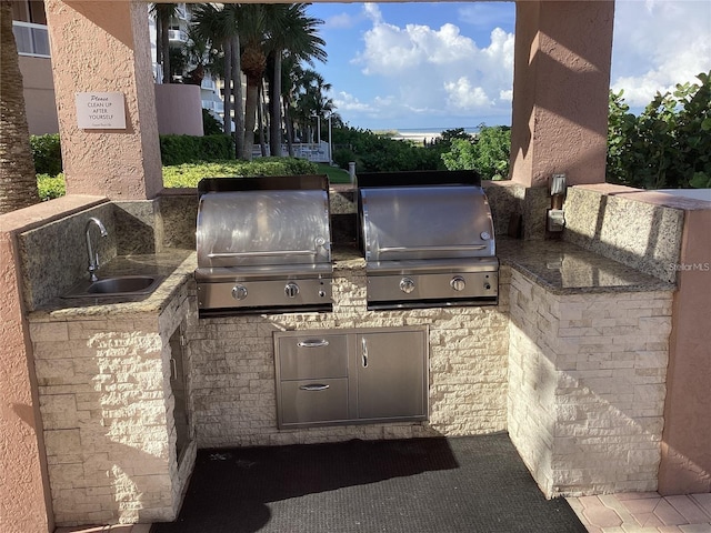 1340 Gulf Blvd Unit 12A, Clearwater Beach, FL 33767 - view of patio with an outdoor kitchen