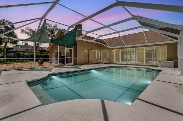 1046 Middlesex Dr, New Port Richey, FL 34655 - outdoor pool with a patio area and glass enclosure