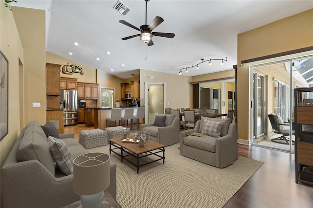 1046 Middlesex Dr, New Port Richey, FL 34655 - living room featuring a ceiling fan, wood finished floors, lofted ceiling, and recessed lighting