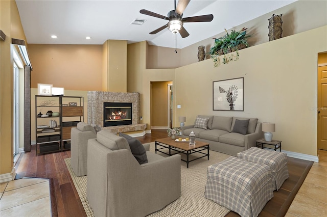 1046 Middlesex Dr, New Port Richey, FL 34655 - living area with a ceiling fan, a glass covered fireplace, recessed lighting, and wood finished floors