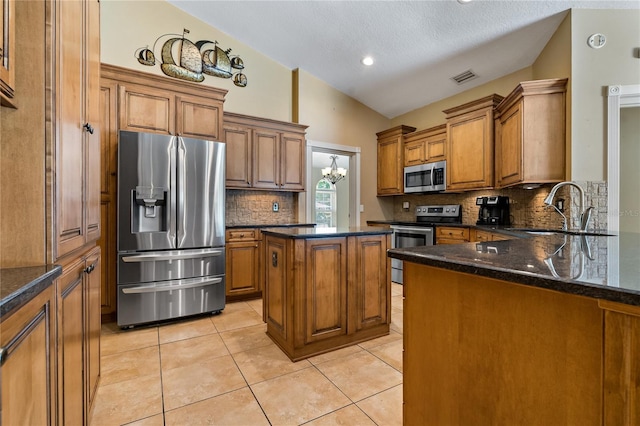 1046 Middlesex Dr, New Port Richey, FL 34655 - kitchen featuring stainless steel appliances, brown cabinetry, backsplash, light tile patterned flooring, and lofted ceiling