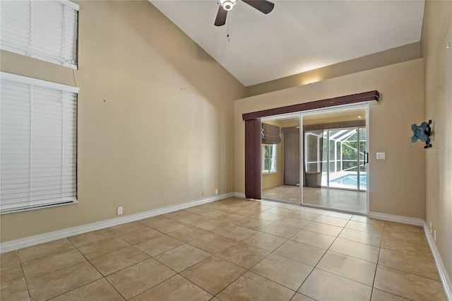 1046 Middlesex Dr, New Port Richey, FL 34655 - unfurnished room featuring ceiling fan, light tile patterned flooring, and high vaulted ceiling
