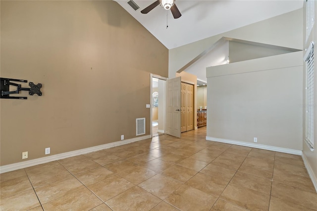 1046 Middlesex Dr, New Port Richey, FL 34655 - unfurnished room featuring high vaulted ceiling, ceiling fan, and light tile patterned floors