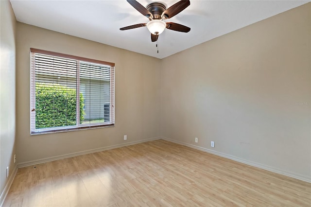 1046 Middlesex Dr, New Port Richey, FL 34655 - empty room with light wood-style floors and a ceiling fan