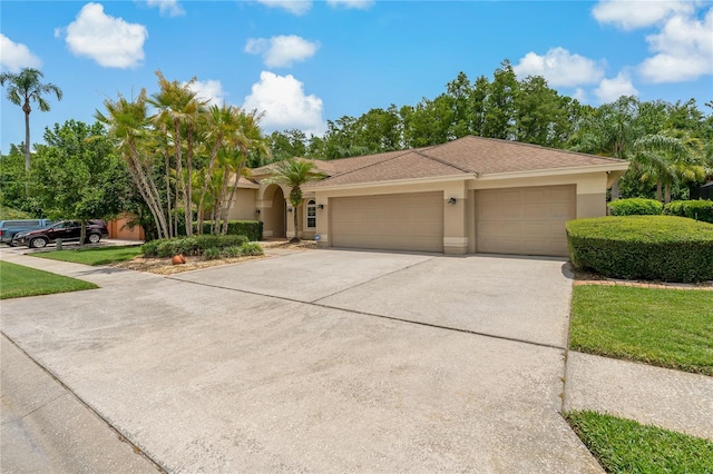 1046 Middlesex Dr, New Port Richey, FL 34655 - view of front of home with stucco siding, an attached garage, and concrete driveway