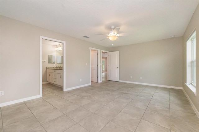 13116 Marathon Blvd, Port Charlotte, FL 33981 - unfurnished bedroom featuring multiple windows, light tile patterned floors, and ceiling fan