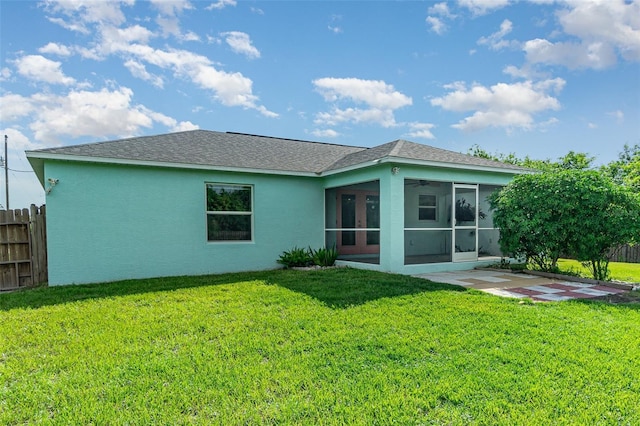 13116 Marathon Blvd, Port Charlotte, FL 33981 - back of house featuring a sunroom, stucco siding, and a patio