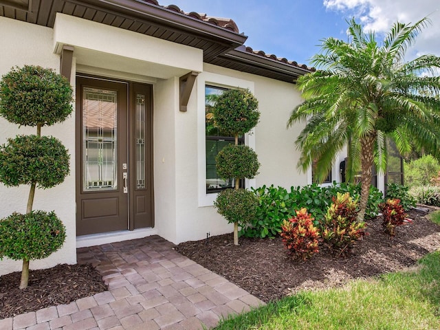 5317 Rushmere Ct, Palmetto, FL 34221 - property entrance featuring stucco siding and a tile roof