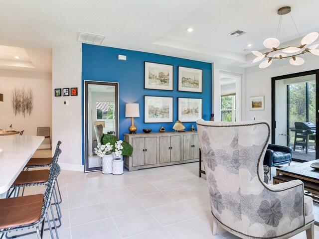 5317 Rushmere Ct, Palmetto, FL 34221 - dining space featuring a raised ceiling, plenty of natural light, a chandelier, recessed lighting, and light tile patterned floors