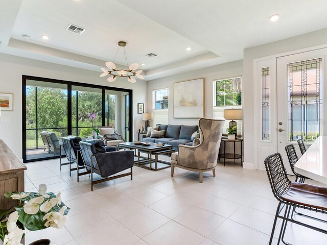 5317 Rushmere Ct, Palmetto, FL 34221 - living area featuring a raised ceiling, a chandelier, light tile patterned flooring, and recessed lighting