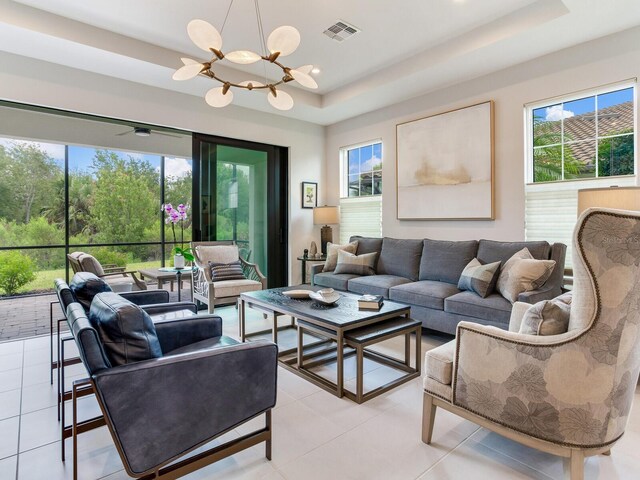 5317 Rushmere Ct, Palmetto, FL 34221 - living area with a tray ceiling, a chandelier, plenty of natural light, and recessed lighting