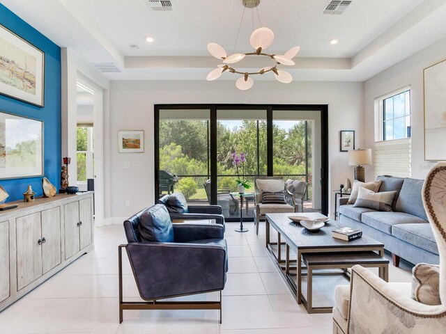 5317 Rushmere Ct, Palmetto, FL 34221 - living area with a raised ceiling, light tile patterned flooring, and recessed lighting