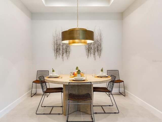 5317 Rushmere Ct, Palmetto, FL 34221 - dining space featuring light tile patterned floors and a tray ceiling