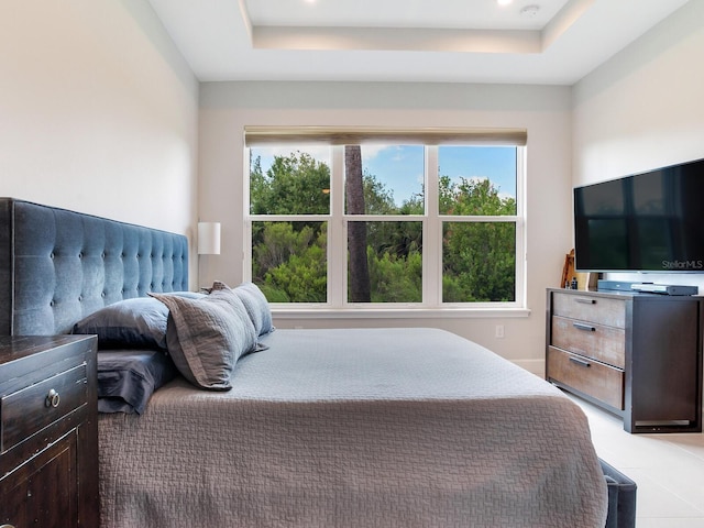 5317 Rushmere Ct, Palmetto, FL 34221 - bedroom featuring multiple windows, a tray ceiling, and light tile patterned flooring
