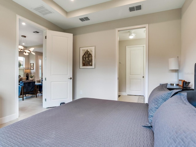 5317 Rushmere Ct, Palmetto, FL 34221 - bedroom with a chandelier and light tile patterned floors