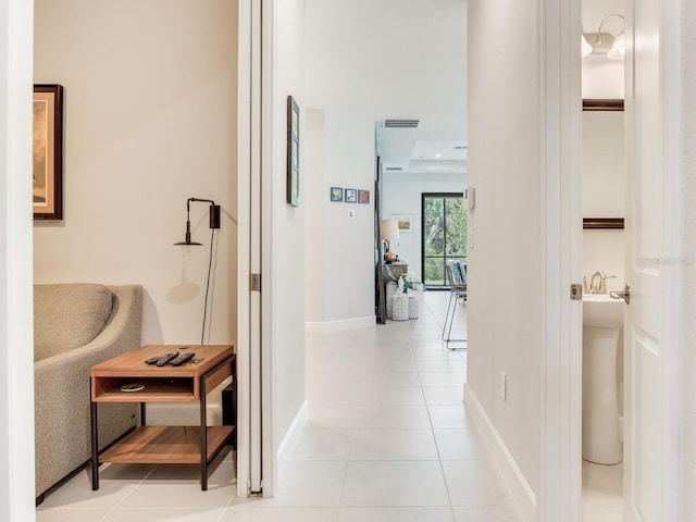 5317 Rushmere Ct, Palmetto, FL 34221 - hall with light tile patterned flooring and baseboards