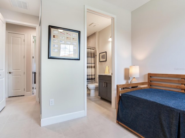 5317 Rushmere Ct, Palmetto, FL 34221 - bedroom with light tile patterned flooring and connected bathroom