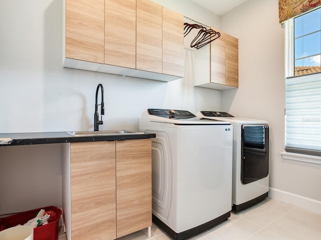 5317 Rushmere Ct, Palmetto, FL 34221 - laundry area featuring cabinet space, washer and dryer, and light tile patterned floors