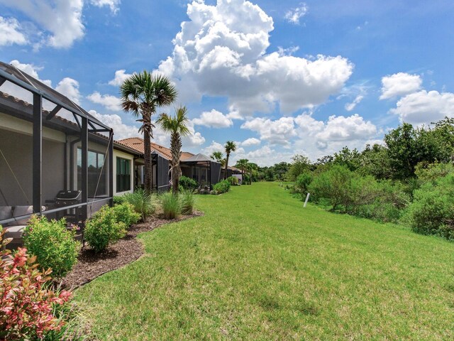 5317 Rushmere Ct, Palmetto, FL 34221 - view of green lawn featuring glass enclosure
